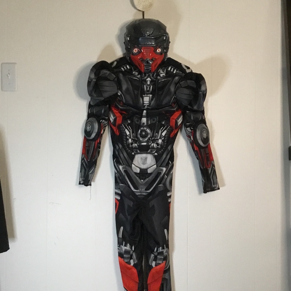 Transformers, Optimus prime
Kids size M-L 50”x15”  Jumpsuit
Halloween, with Mask
